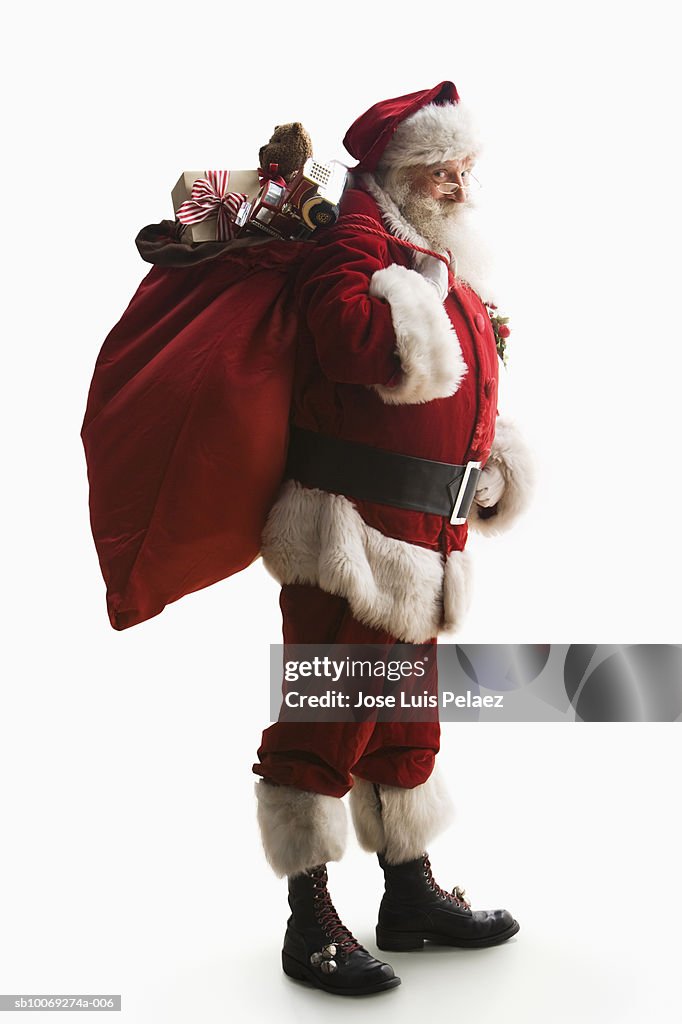 Santa Claus carrying sack of gifts, portrait, close-up