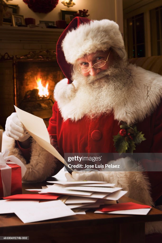 Santa Clause holding letter, portrait, close-up