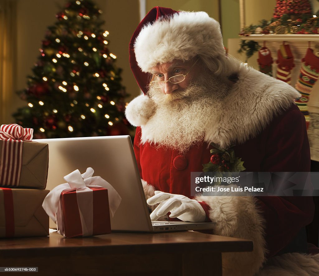 Santa Clause using laptop, close-up