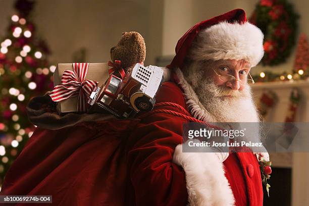 santa claus carrying sack of gifts, portrait, close-up - sack 個照片及圖片檔