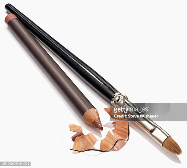 pencil with shavings and brush, studio shot - konturstift stock-fotos und bilder