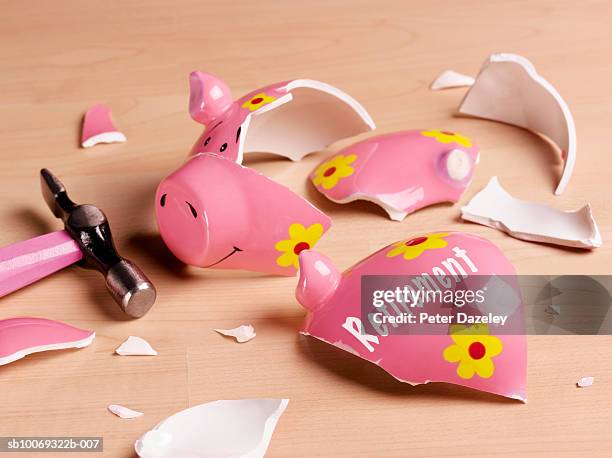 broken piggy bank, studio shot - hopelessness stock pictures, royalty-free photos & images