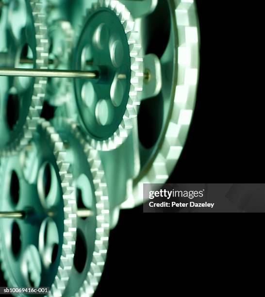 moving cogs, close-up - co ordination stock pictures, royalty-free photos & images