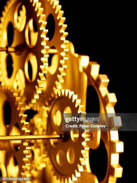 cogs in motion., close-up - co ordination stock pictures, royalty-free photos & images