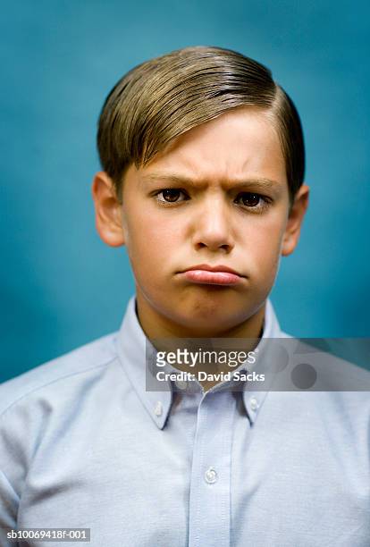 boy (10-11) grimacing, portrait, close-up - disappointment stock pictures, royalty-free photos & images