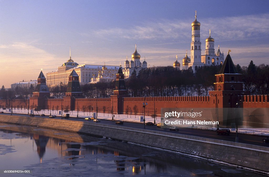 Russia, Moscow, Church of Archangel Michael and Assumption Cathedral behind Kremlin Wall at sunrise