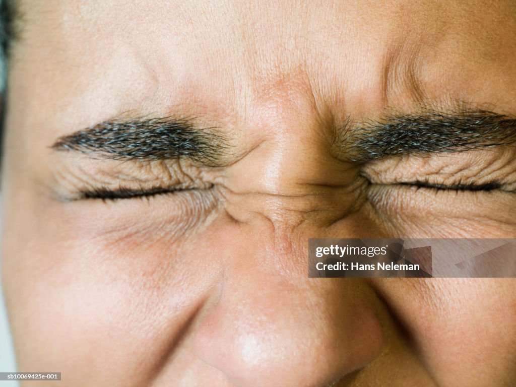 Young woman blinking, close-up