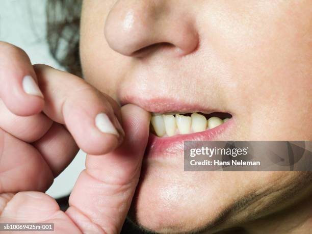 woman biting nails, close-up - nail biting stock pictures, royalty-free photos & images