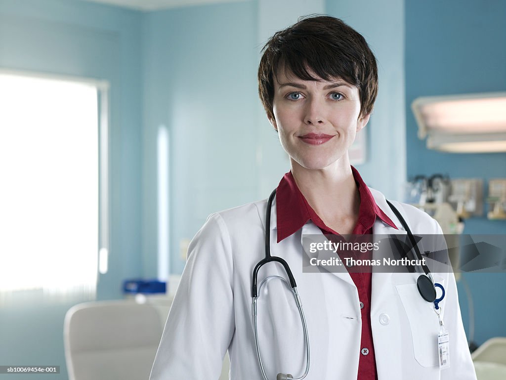 Female doctor in hospital room, portrait