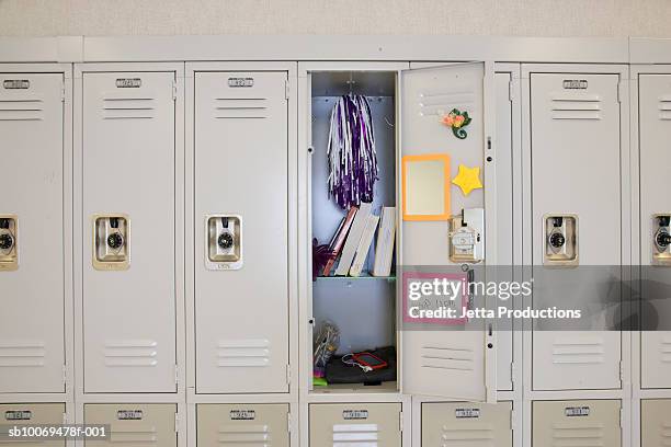 open locker in high school - lockerkast stockfoto's en -beelden