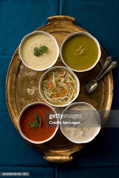 five bowls with soups on tray, view from above - sopa de pollo con fideos fotografías e imágenes de stock