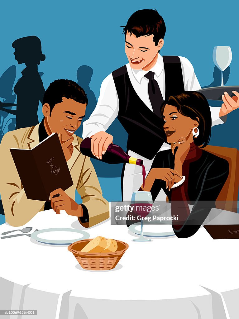 Waiter serving couple in restaurant