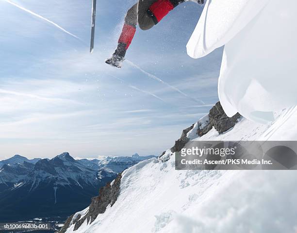 man skiing, low angle view - hero image stock pictures, royalty-free photos & images