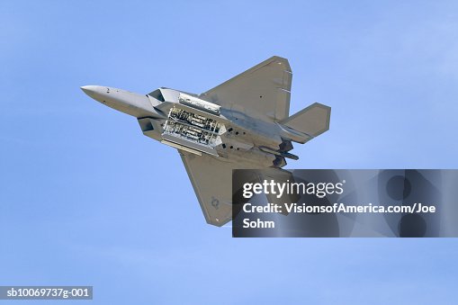 US Air Force F-22A Raptor Jet Fighter in flight, directly below US Air Force F-22A Raptor Jet Fighter in flight, directly below