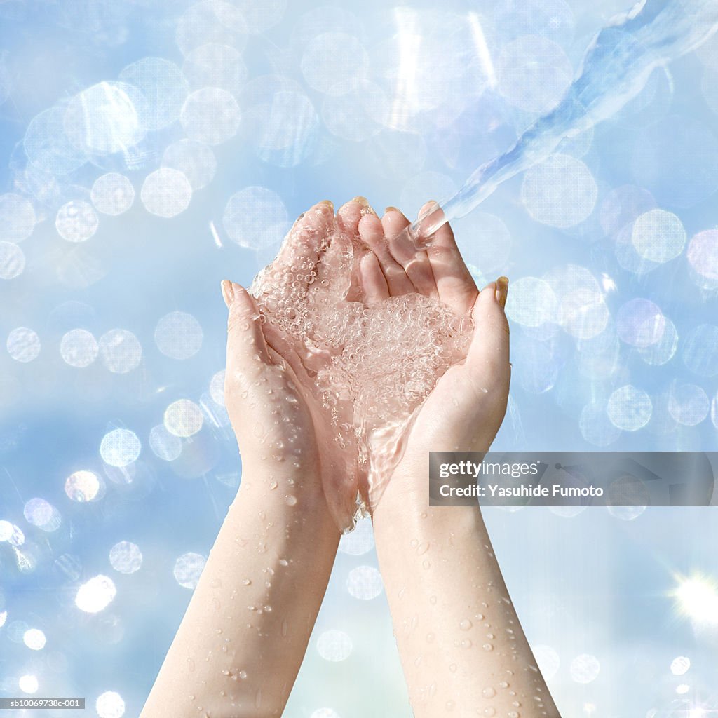 Water in woman's cupped hands