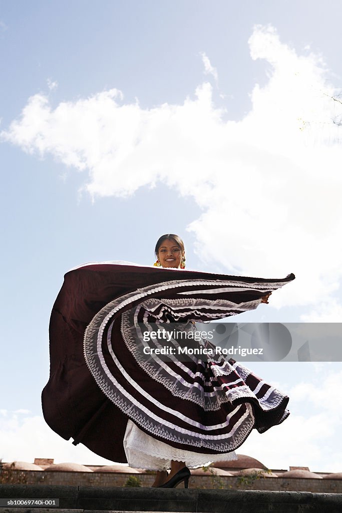 Mexico, Oaxaca, Istmo, woman in traditional dress dancing