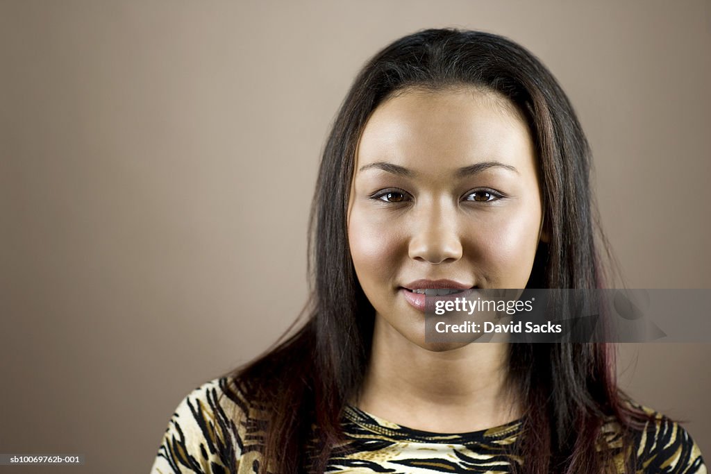 Young woman smiling, portrait, close-up