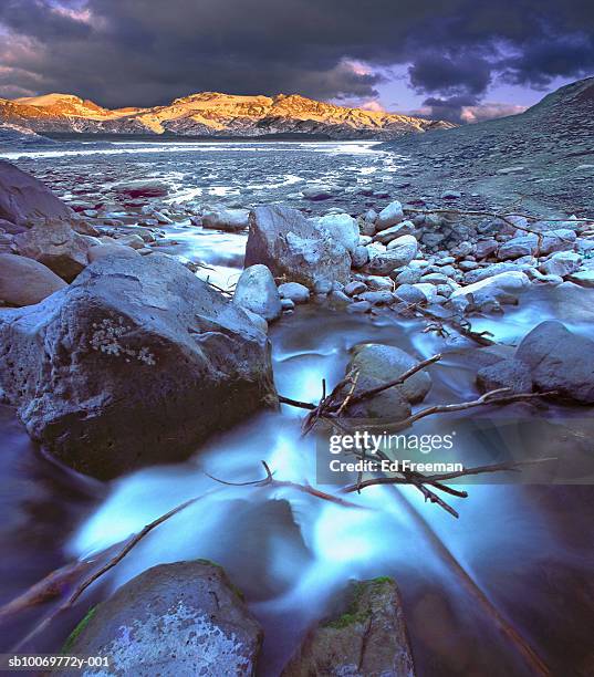 usa, arizona, iceland, rocky stream with sunlit mountains (digital composite) - july 1998 stock pictures, royalty-free photos & images