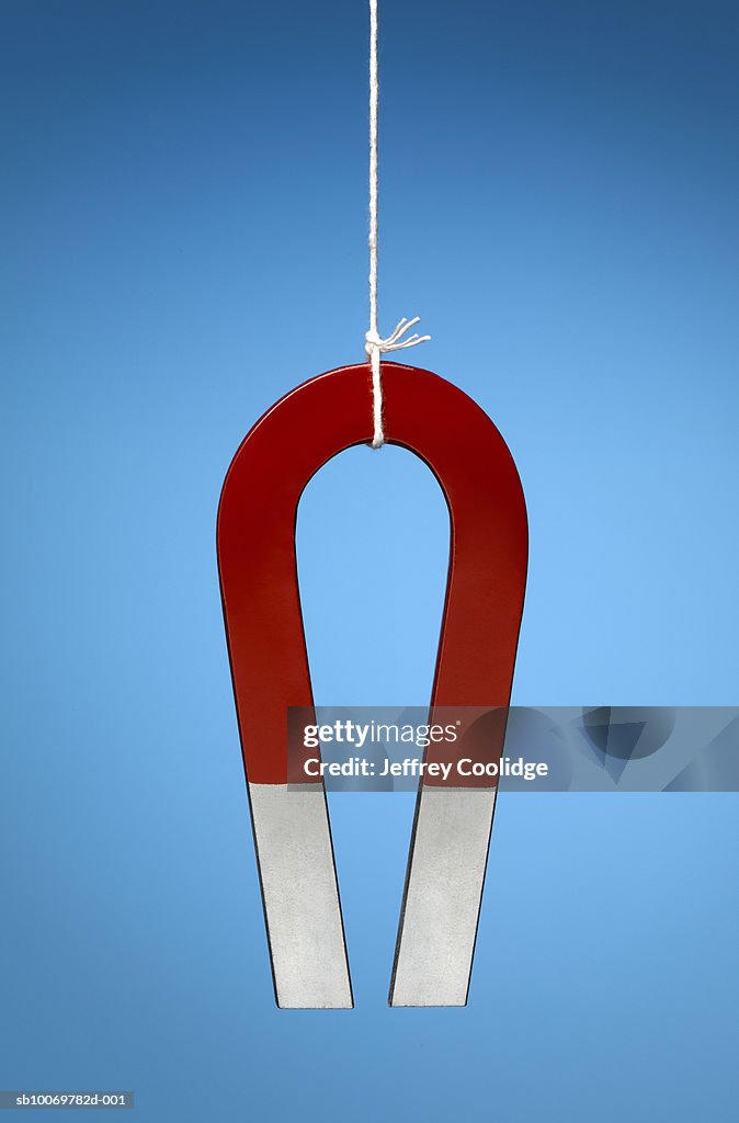 Magnet Hanging On String Studio Shot High-Res Stock Photo - Getty Images