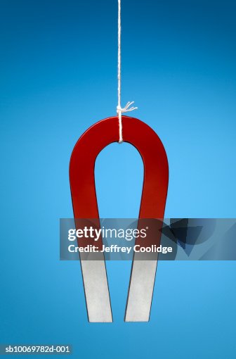 Magnet Hanging On String Studio Shot High-Res Stock Photo - Getty Images