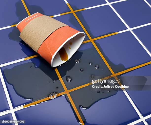disposable coffee cup crushed on tile floor, studio shot - spill floor stock pictures, royalty-free photos & images