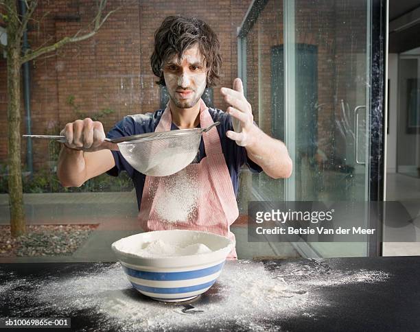 man preparing flour for baking - failure foto e immagini stock