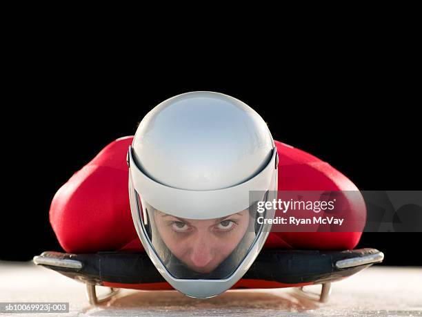 woman skeleton athlete in crash helmet on skeleton, portrait, close-up - skeleton foto e immagini stock