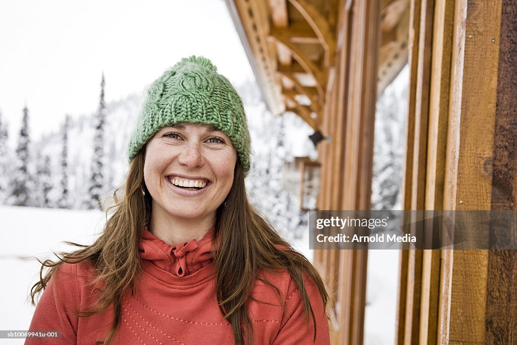 Portrait of woman smiling outside Backcountry ski lodge