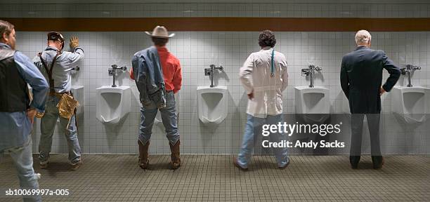 four men standing at urinal, rear view (digital composite) - chelsea michigan stock pictures, royalty-free photos & images