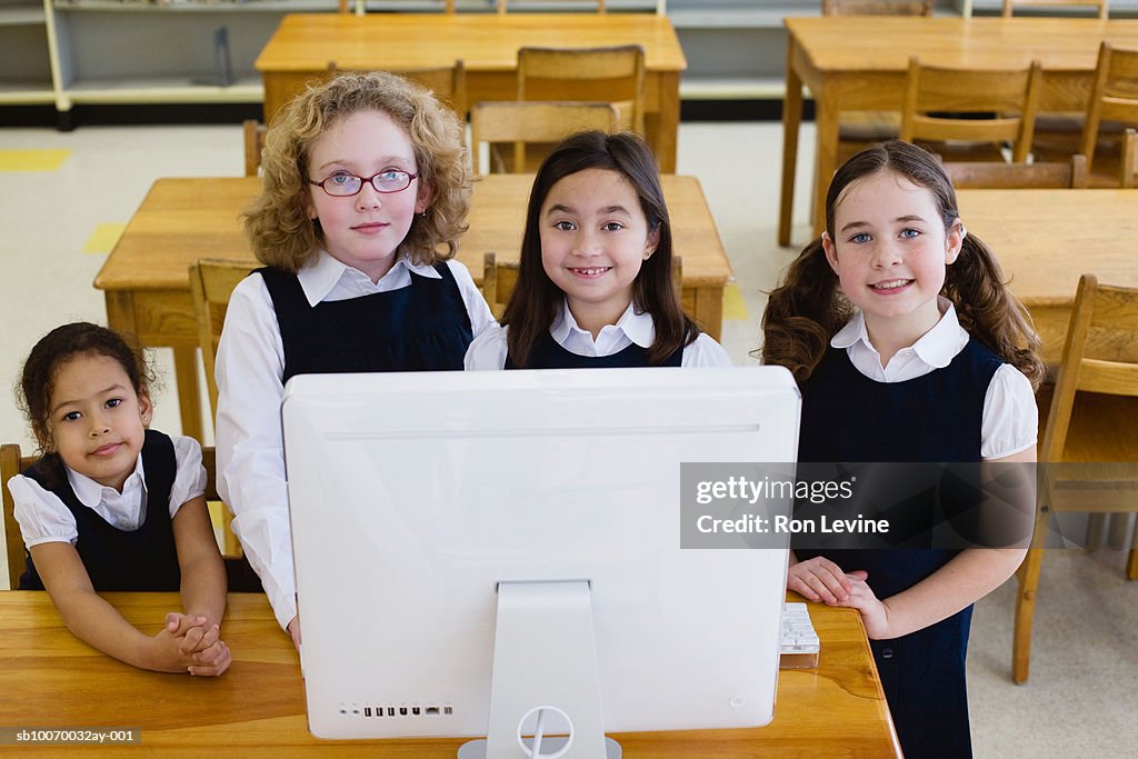 5 Girls Using Computer Four Girls Using Computer In School Classroom Portrait High-Res Stock ...