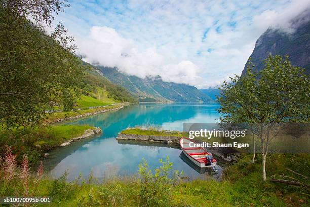norway, western fjords, nordfjord, rowboat on lake in mountains - olden foto e immagini stock