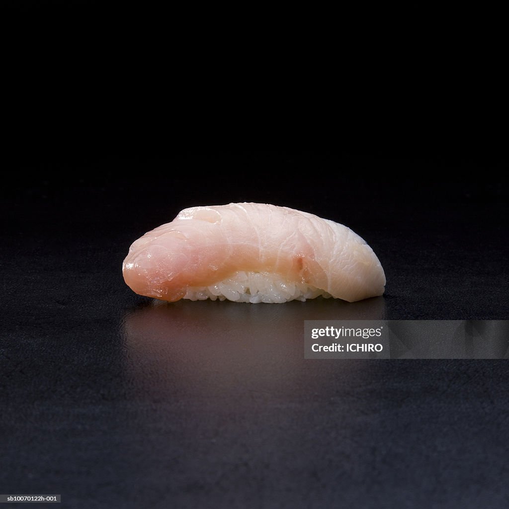 Buri Nigiri Sushi on black background