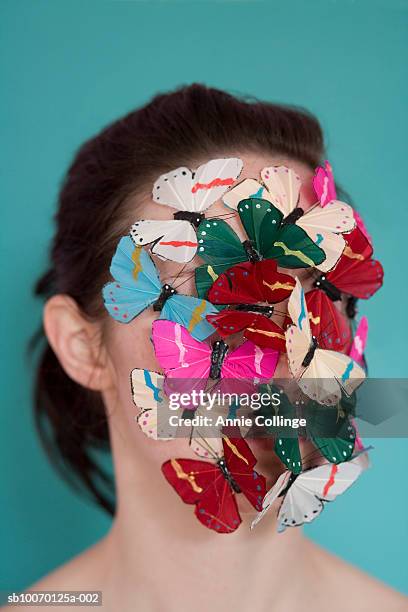 woman's face covered with butterflies - human butterfly stock pictures, royalty-free photos & images