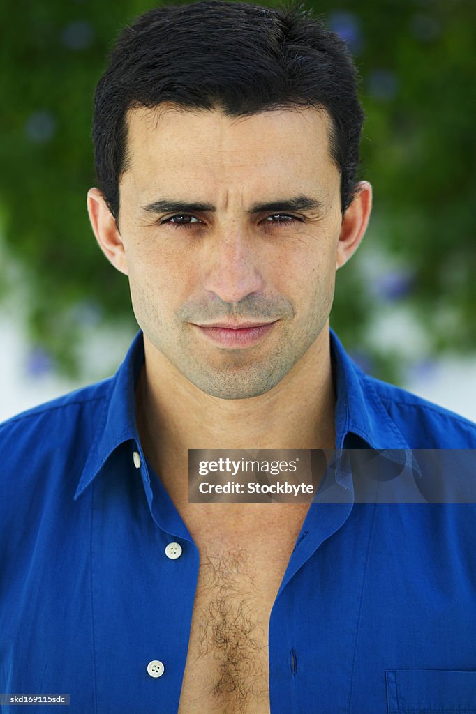 Close-up portrait of a man looking serious