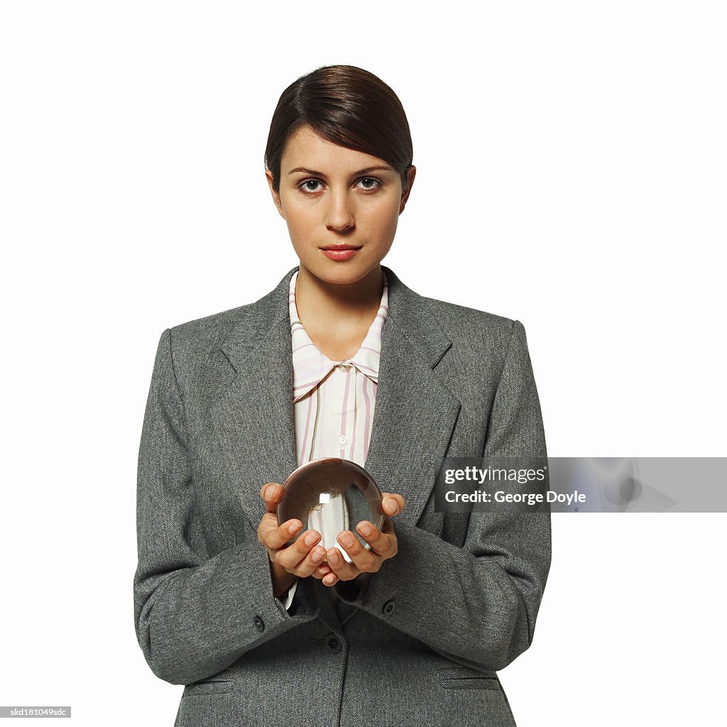 Portrait of a businesswoman holding a crystal ball