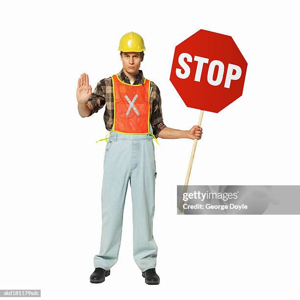 Avoid. Sign Workers 237 Construction Worker Stop Sign Stock Photos, High-Res Pictures, and ...