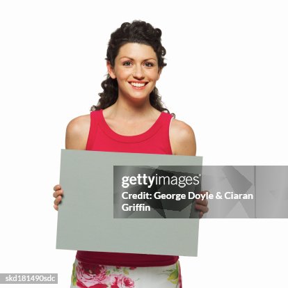 Portrait of woman holding blank card Portrait of woman holding blank card