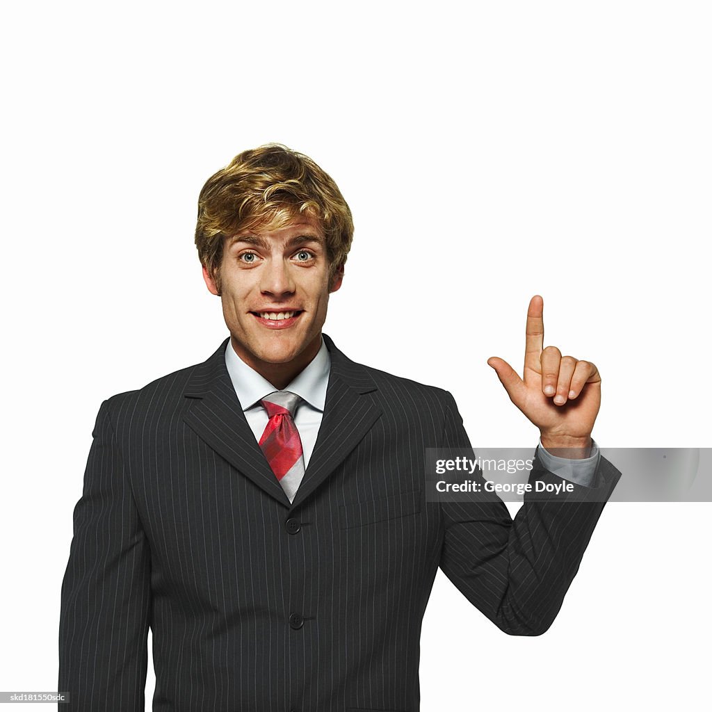 Portrait of a businessman raising a finger