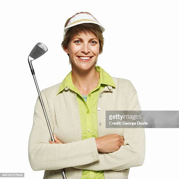 portrait of a woman holding a golf club - golf club on white stock pictures, royalty-free photos & images