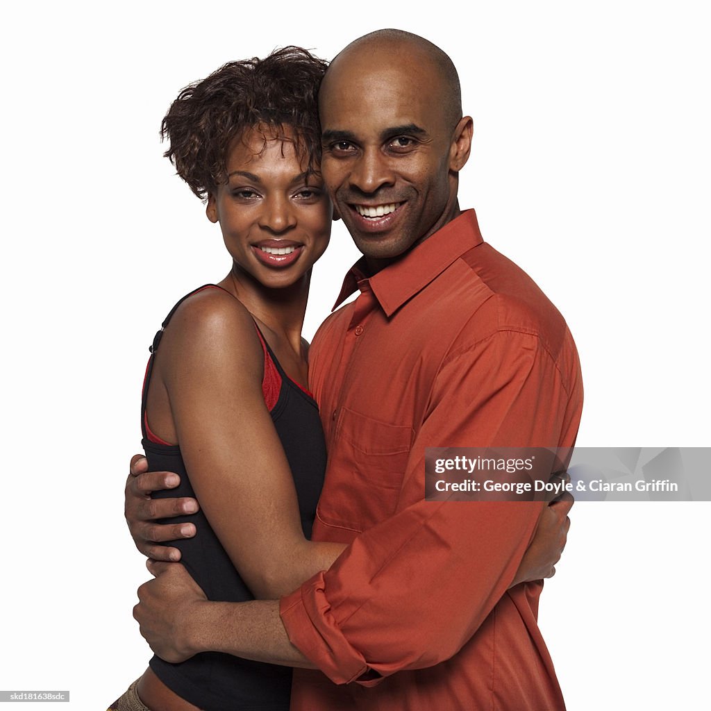 Close-up portrait of mid adult couple hugging