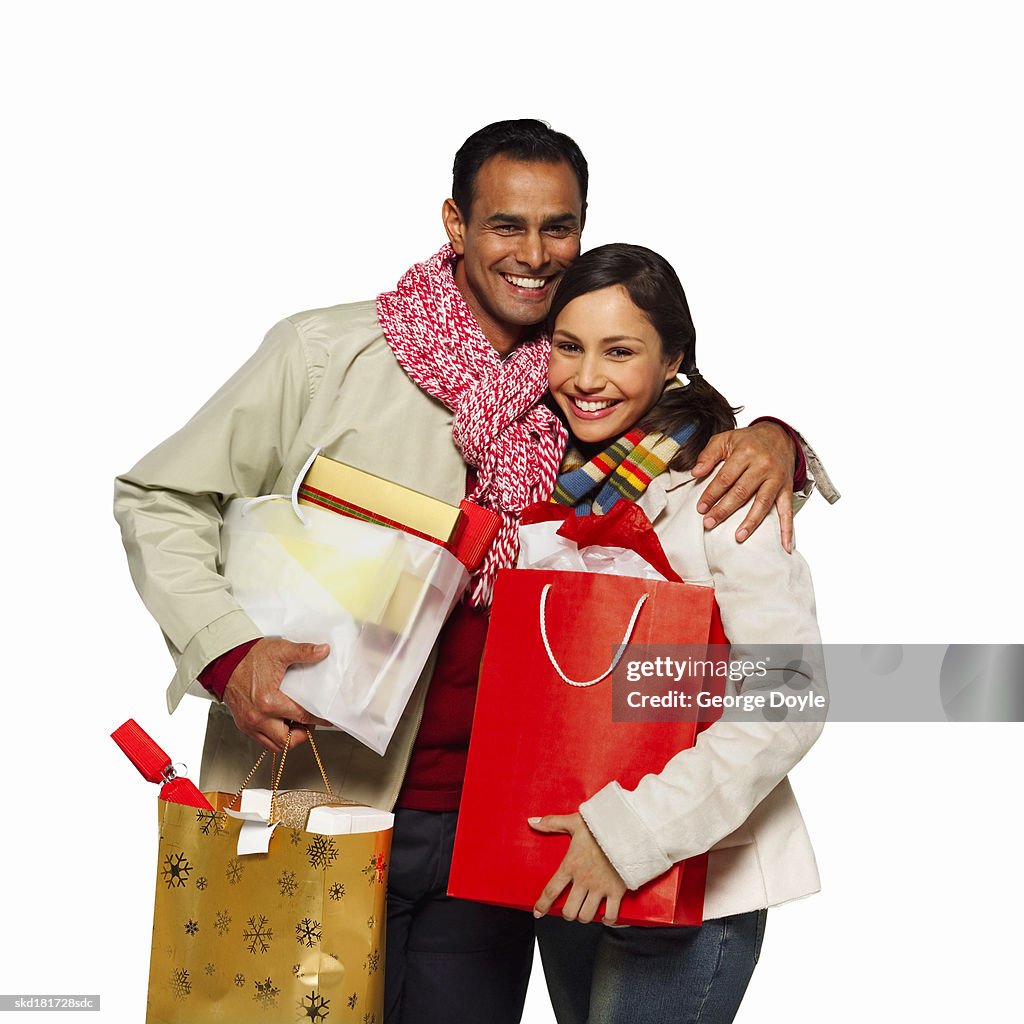 Portrait of a boyfriend and girlfriend with shopping bags