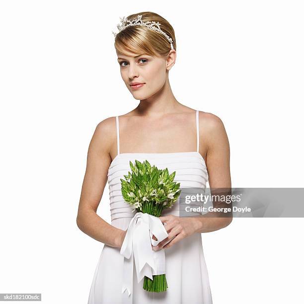 front view portrait of a bride holding a bouquet - tiara isolated stock pictures, royalty-free photos & images