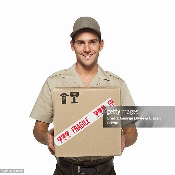 portrait of a delivery man - delivery person on white stock pictures, royalty-free photos & images