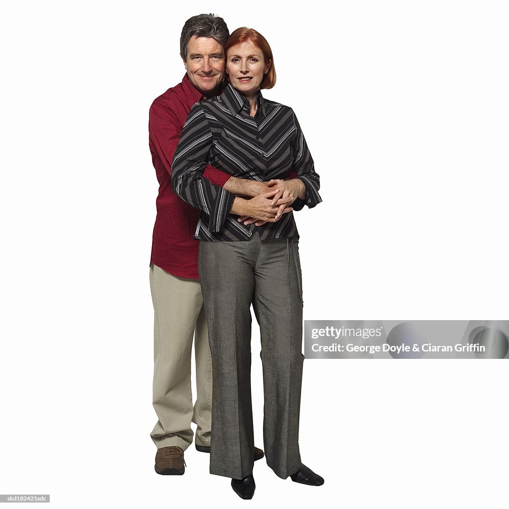 Front view portrait of senior couple holding each other