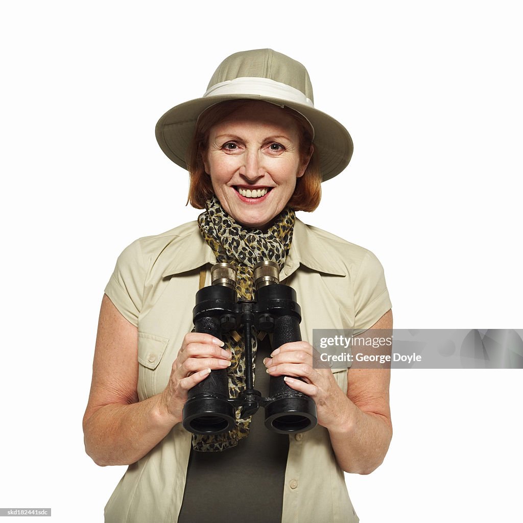 Portrait of woman holding binoculars