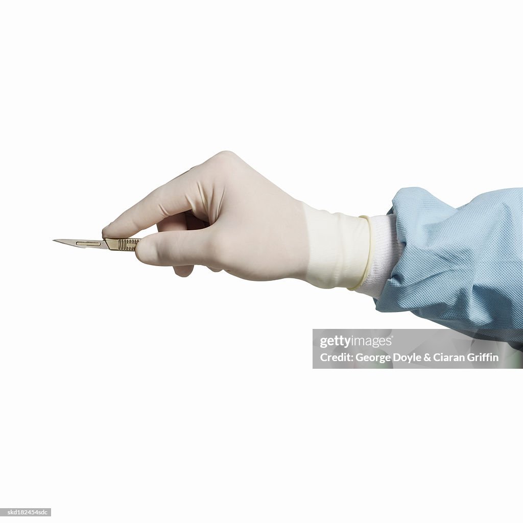 Close-up of surgeon's hand holding scalpel