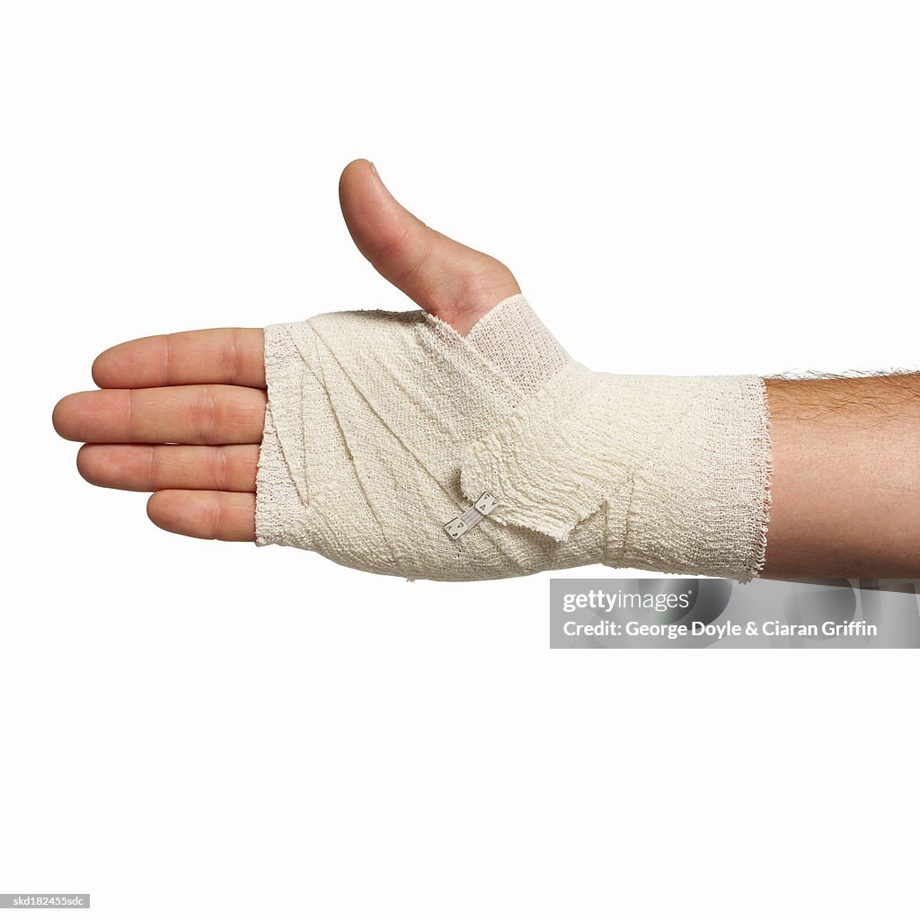 Close-up of man's hand wearing bandage