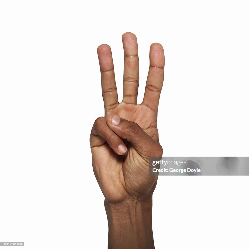 3 Finger Hand Rapper Closeup Of Male Hand Holding Three Fingers Up High-Res Stock Photo ...