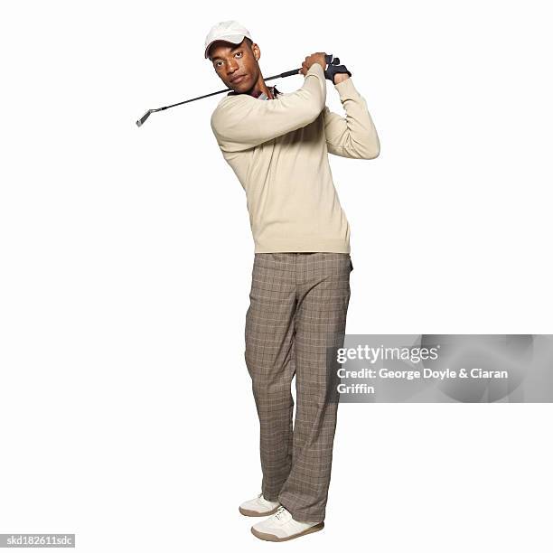 portrait of a golfer - studio shot stock-fotos und bilder