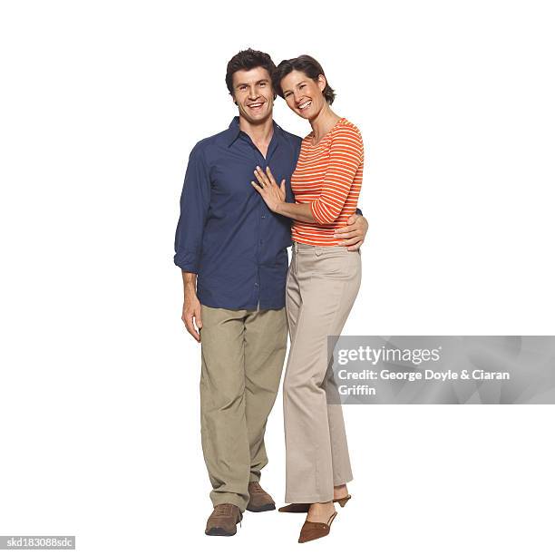 portrait of a husband and wife embracing - man touching womans waist fotografías e imágenes de stock